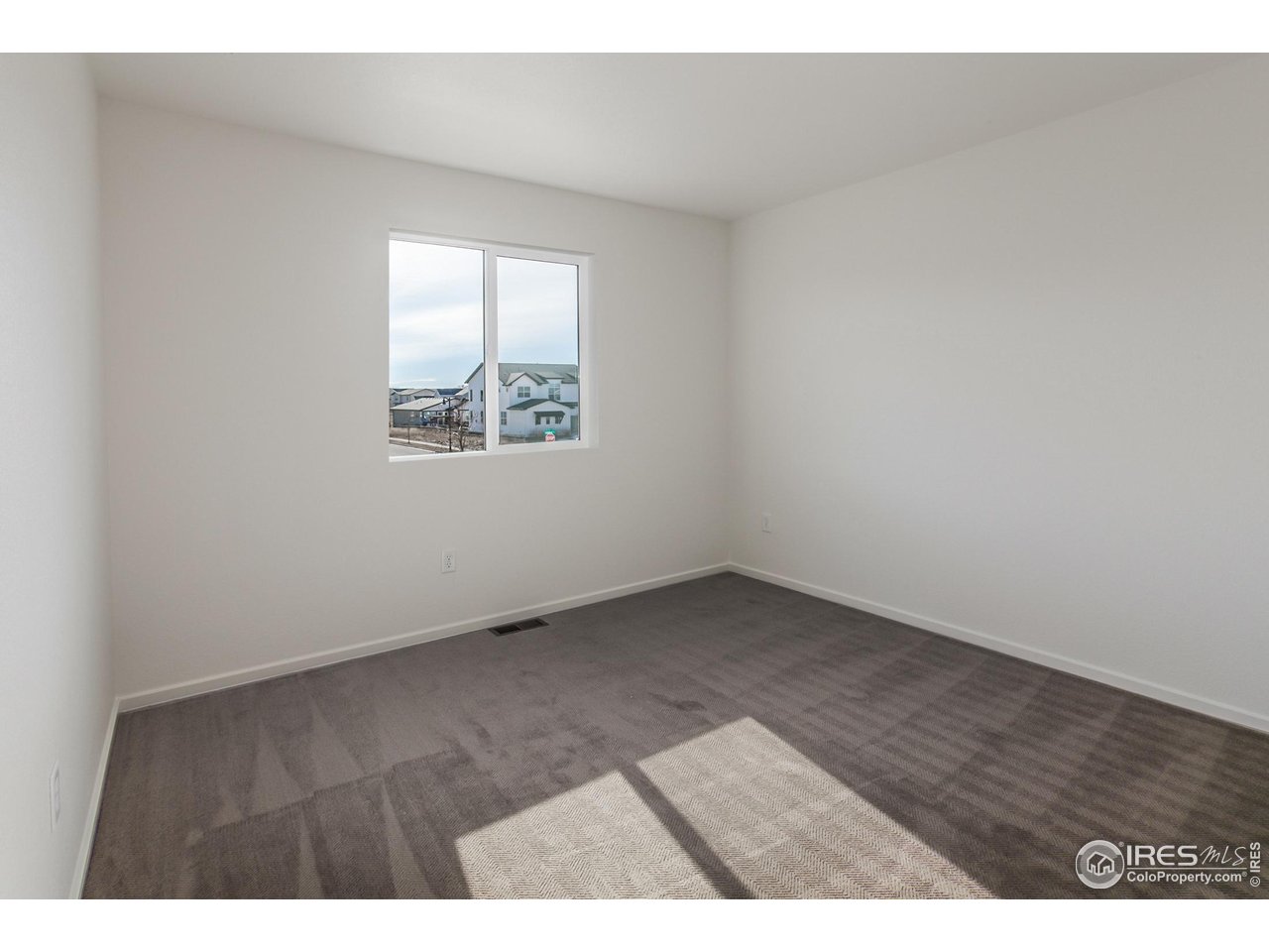 5701 Stone Fly Drive Timnath, CO 80547 - Photo 26 of 48 a view of an empty room and window