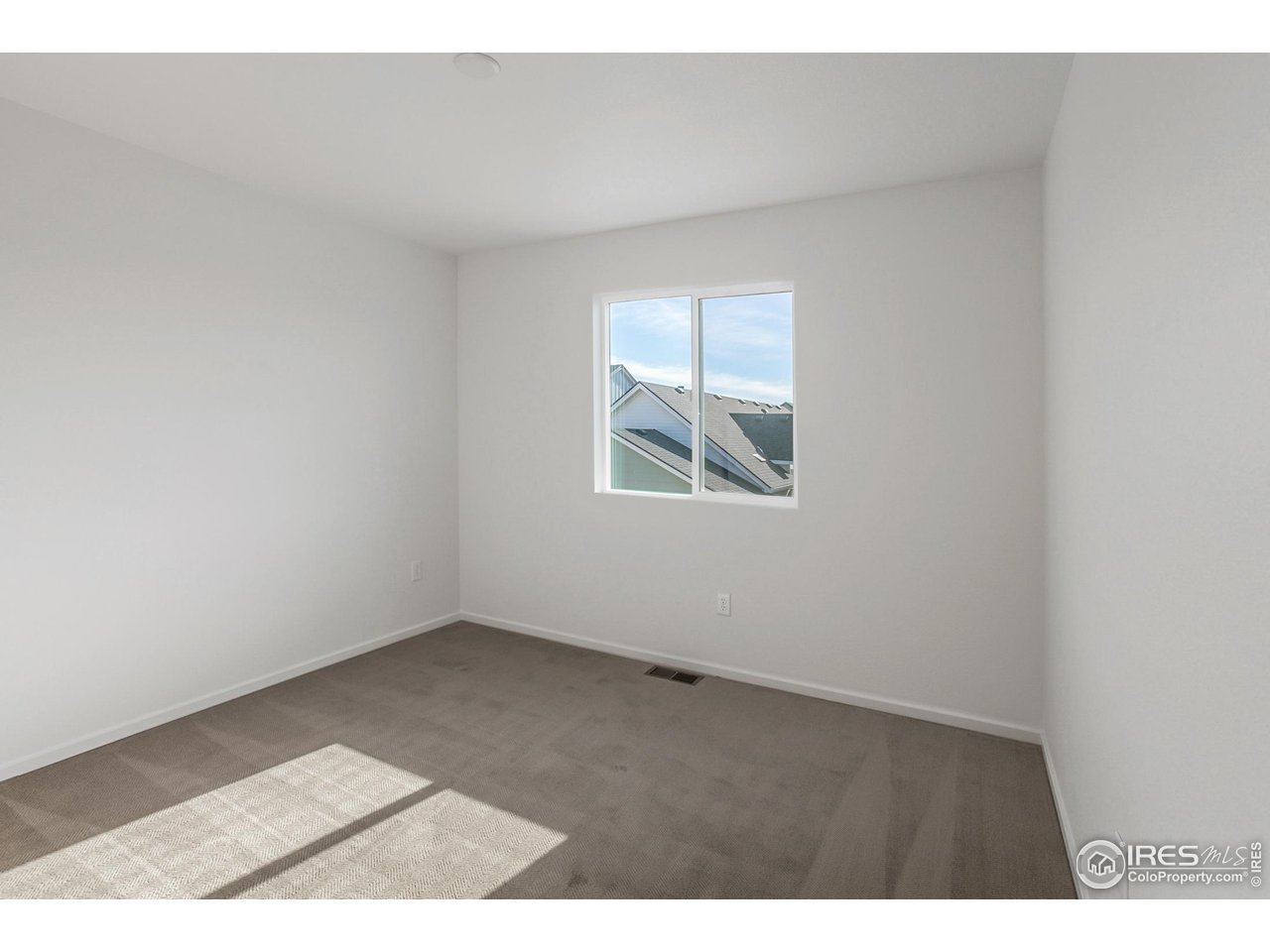 5701 Stone Fly Drive Timnath, CO 80547 - Photo 28 of 48 an empty room with windows