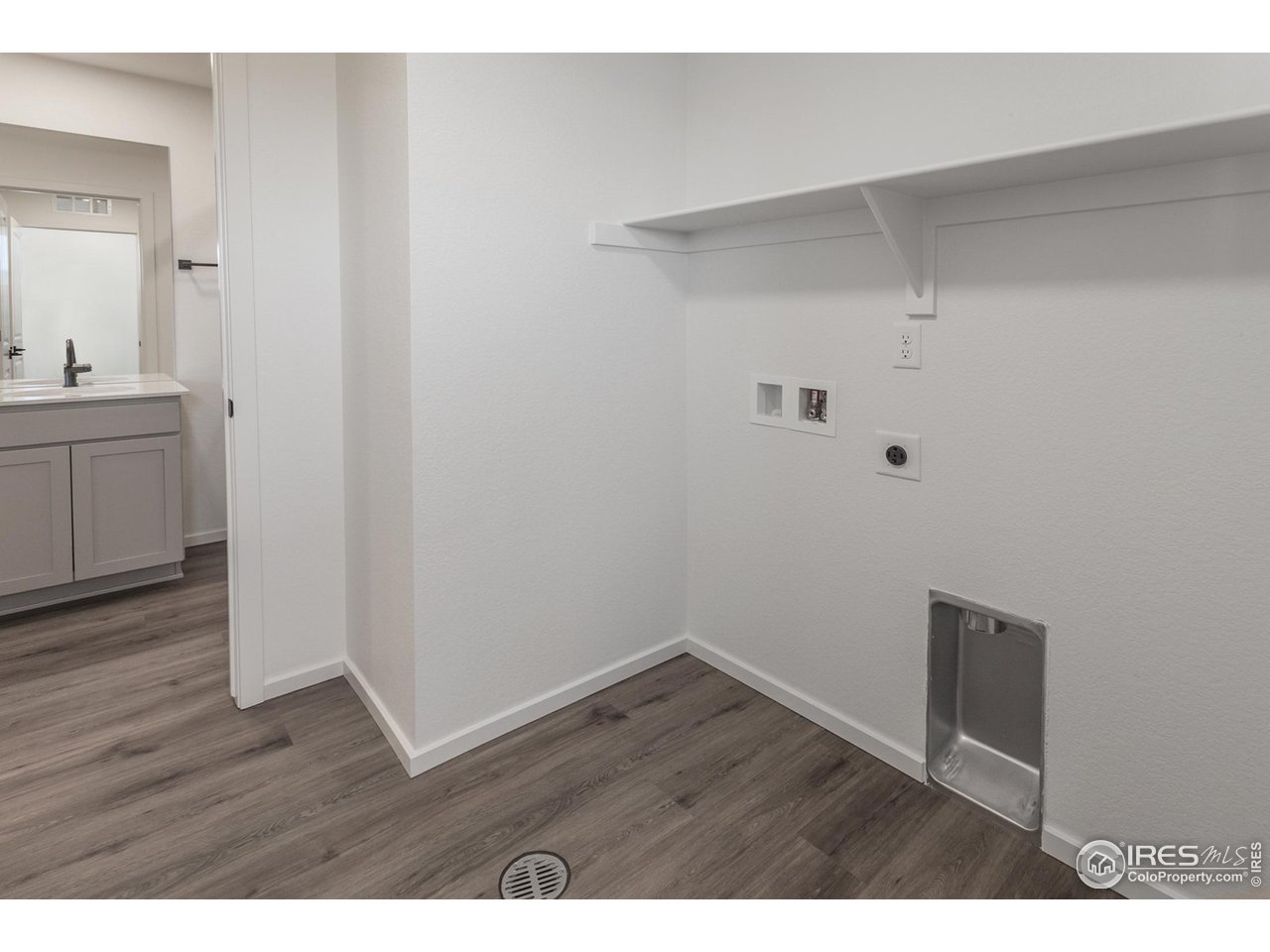 5701 Stone Fly Drive Timnath, CO 80547 - Photo 29 of 48 a view of an empty room with wooden floor