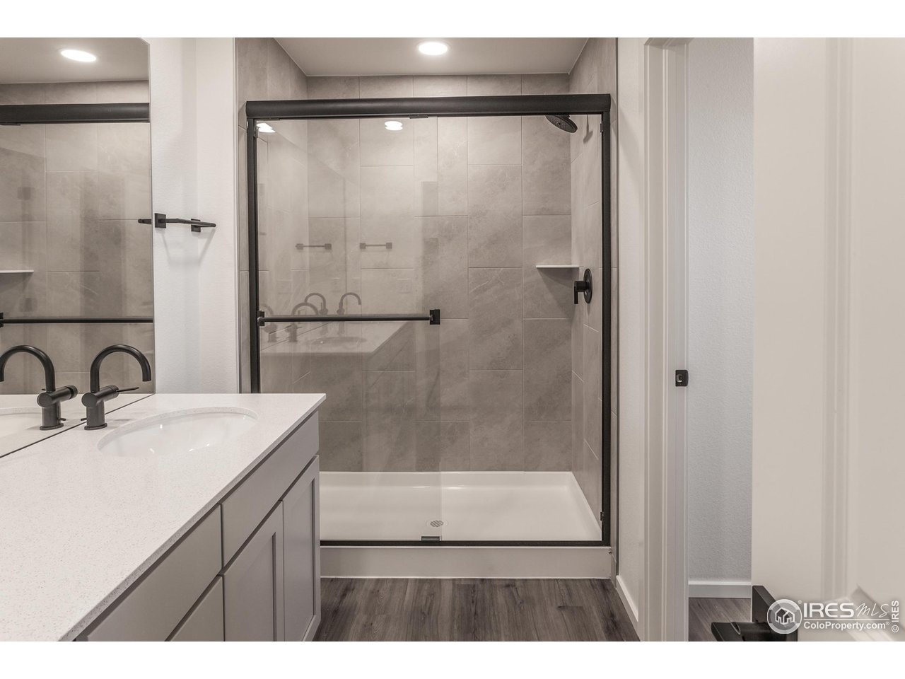 5701 Stone Fly Drive Timnath, CO 80547 - Photo 34 of 48 a bathroom with a sink and a mirror