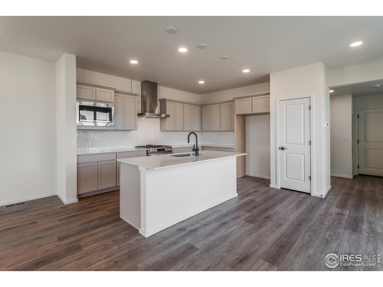 5701 Stone Fly Drive Timnath, CO 80547 - Photo 9 of 48 a view of kitchen with granite countertop stainless steel appliances refrigerator sink and cabinets
