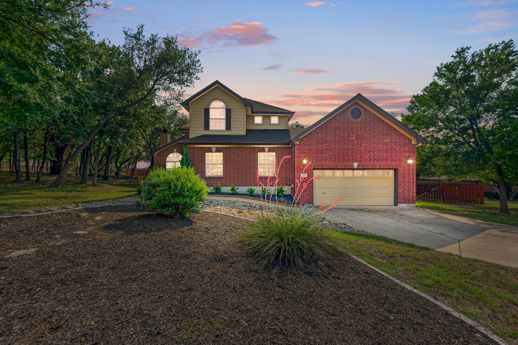 133 Ridgewood Cove Georgetown, TX 78633 - Photo 1 of 1 Traditional-style house with concrete driveway, an attached garage, and brick siding