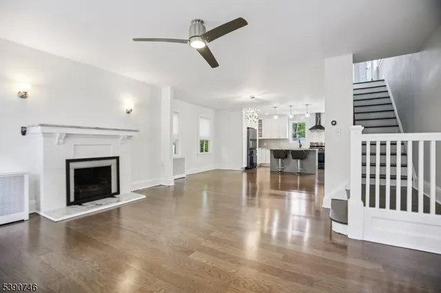 a view of dining room with furniture wooden floor and a fireplace