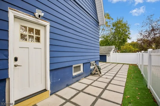 a view of house with backyard and a patio