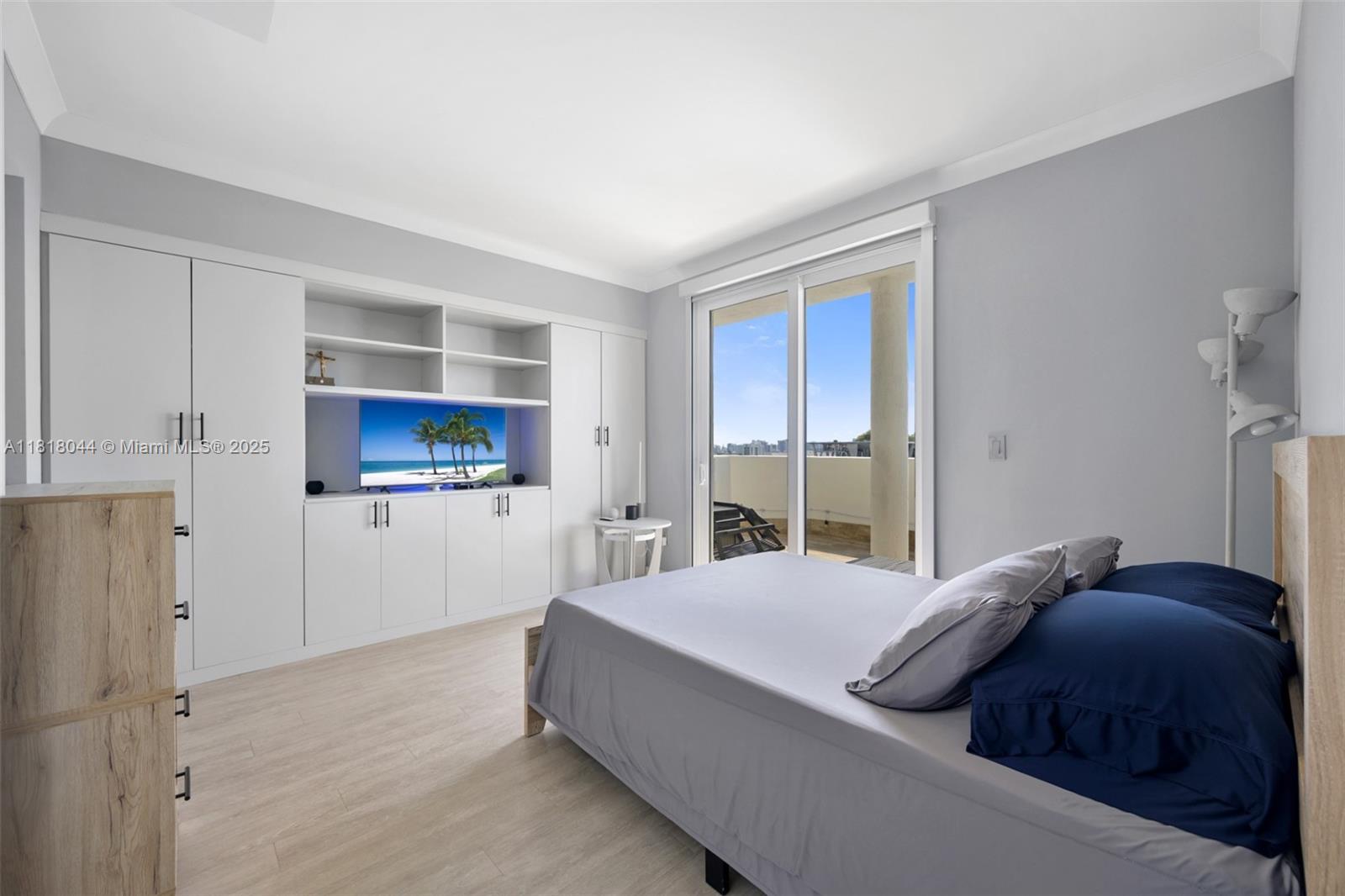 1621 Bay Road, Unit PH3 Miami Beach, FL 33139 - Photo 20 of 24 a bedroom with a bed and a view of kitchen