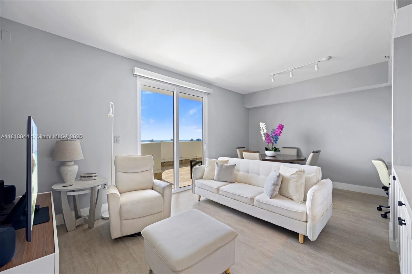 1621 Bay Road, Unit PH3 Miami Beach, FL 33139 - Photo 5 of 24 a living room with furniture and a couch