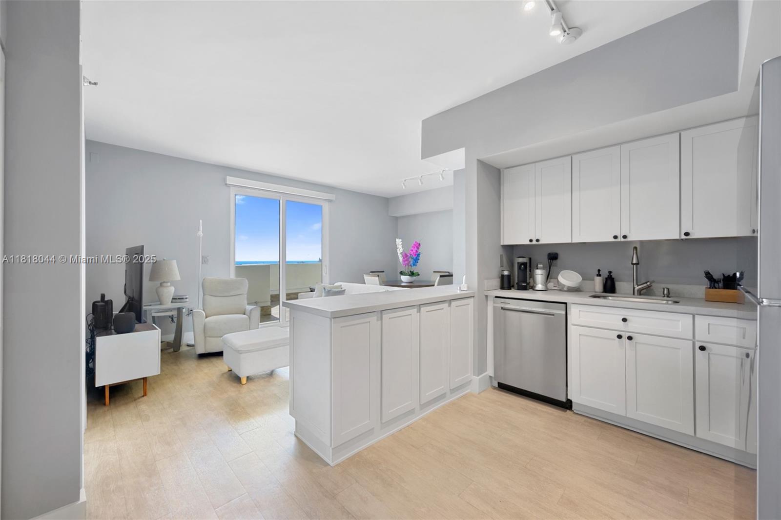 1621 Bay Road, Unit PH3 Miami Beach, FL 33139 - Photo 10 of 24 a kitchen with cabinets a sink and appliances