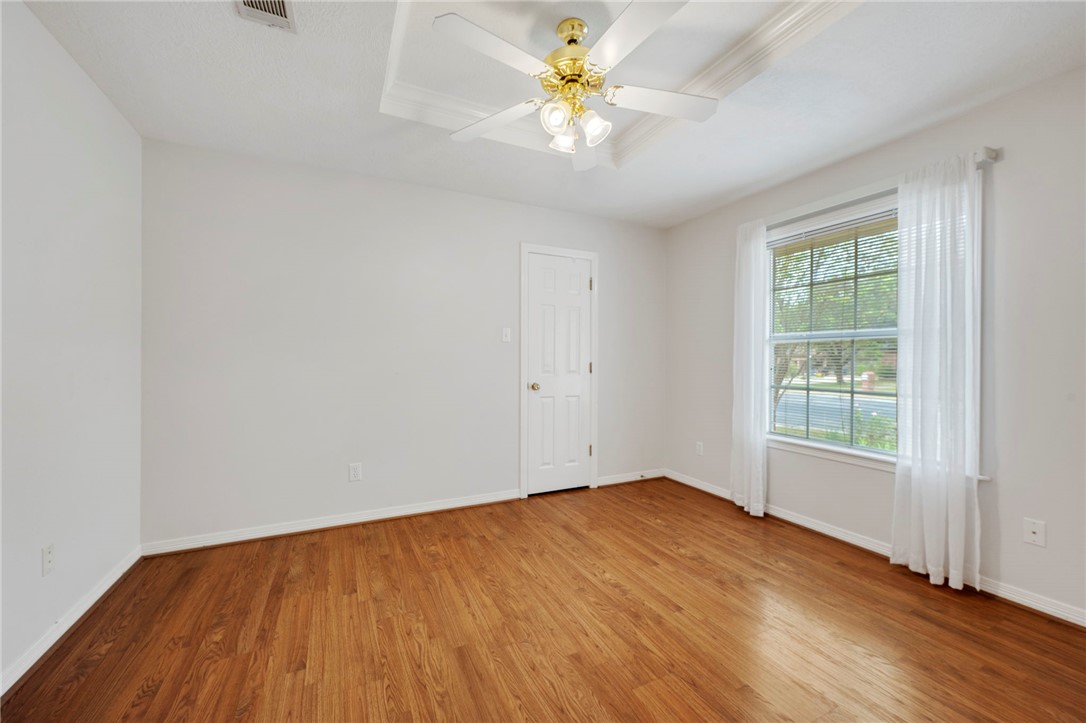 713 Willow Loop College Station, TX 77845 - Photo 26 of 39 an empty room with wooden floor and a window