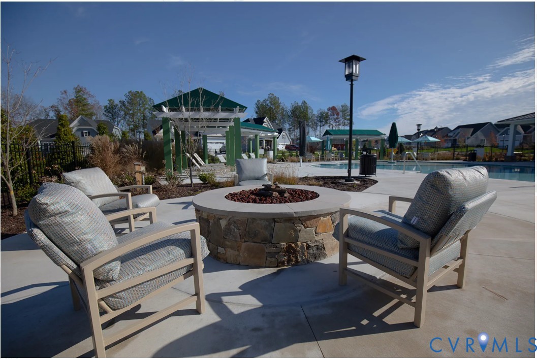 19007 Palisades Ridge Moseley, VA 23120 - Photo 12 of 21 a view of a terrace with furniture and a fire pit