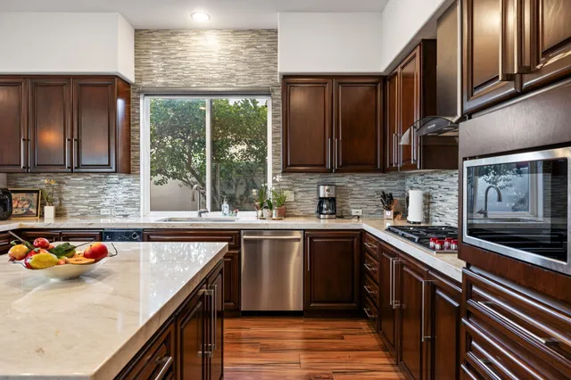 a kitchen with sink and cabinets