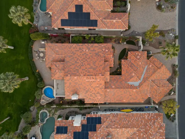 an aerial view of a house with a lake view