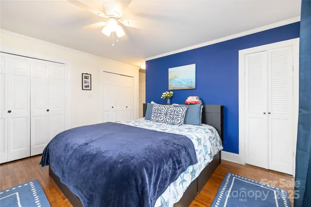 a bedroom with bed and window