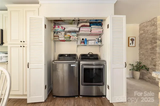 a kitchen with stainless steel appliances and cabinets