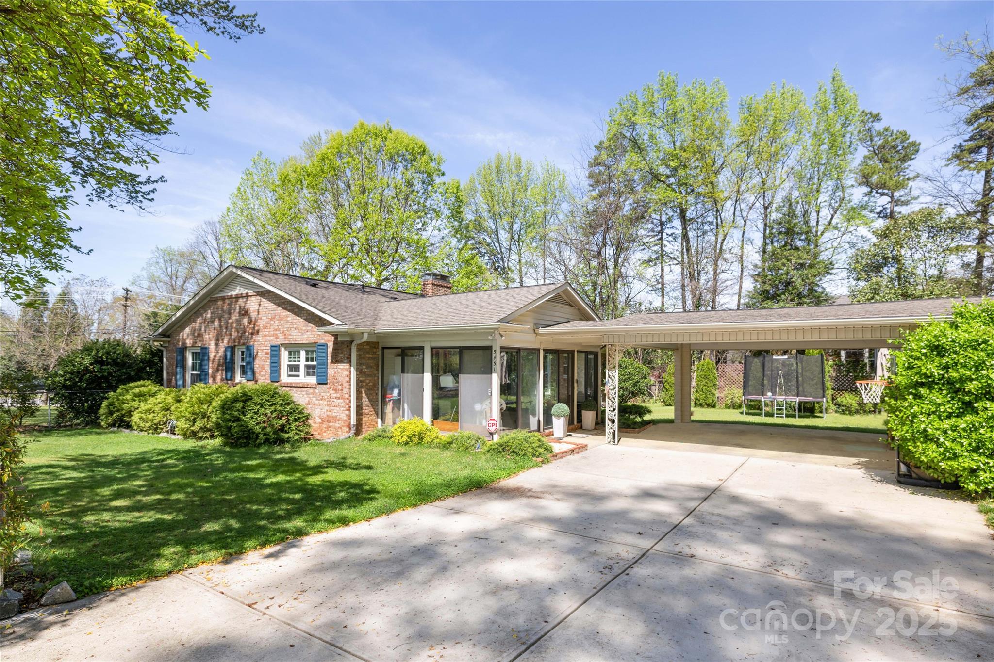 5431 Park Road Charlotte, NC 28209 - Photo 23 of 26 a front view of a house with a garden