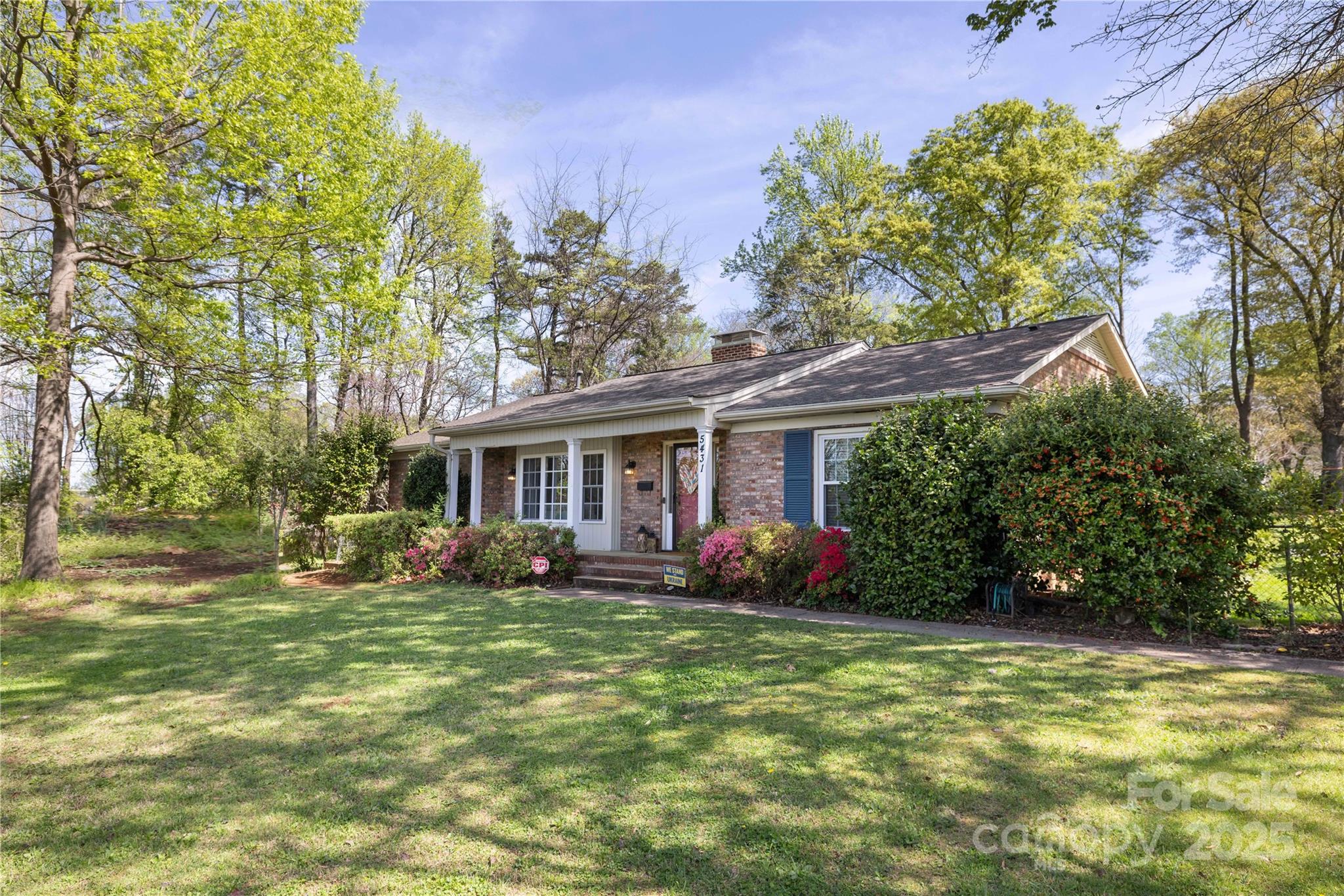 5431 Park Road Charlotte, NC 28209 - Photo 3 of 26 a front view of a house with garden