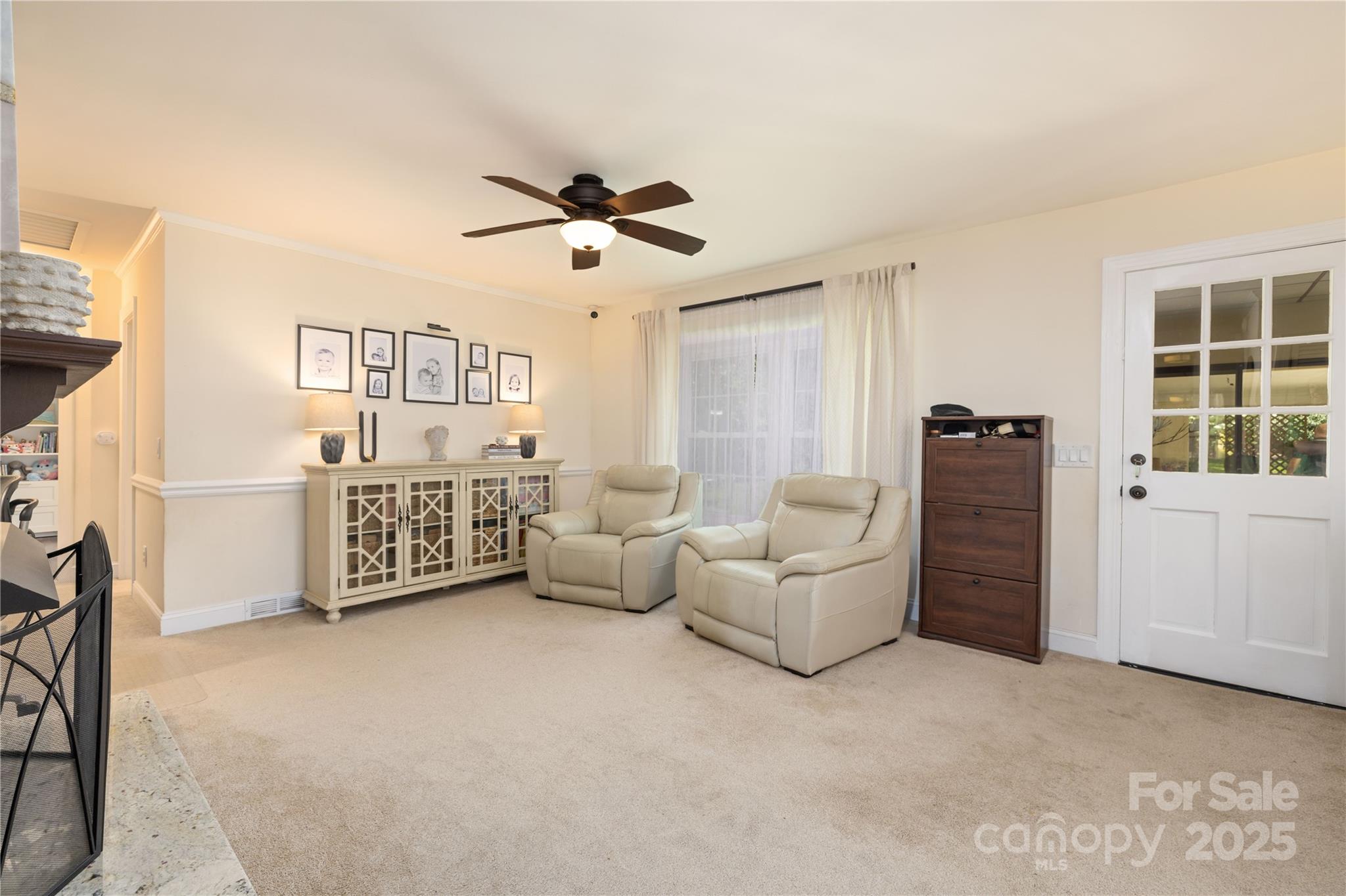 5431 Park Road Charlotte, NC 28209 - Photo 10 of 26 a living room with furniture and a ceiling fan
