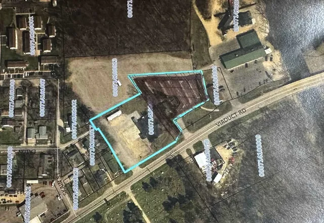 an aerial view of a house with roof deck