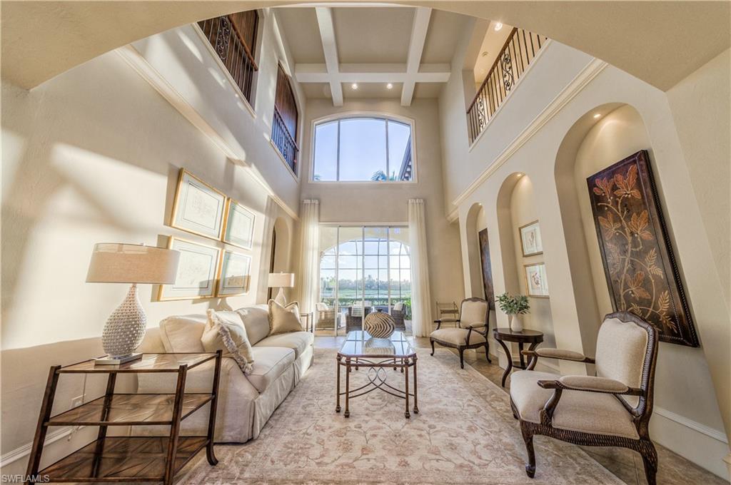 2829 Capistrano Way Naples, FL 34105 - Photo 14 of 35 a living room with furniture and a large window
