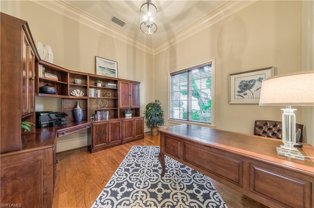 2829 Capistrano Way Naples, FL 34105 - Photo 23 of 35 a large living room with stainless steel appliances furniture a rug and a large window