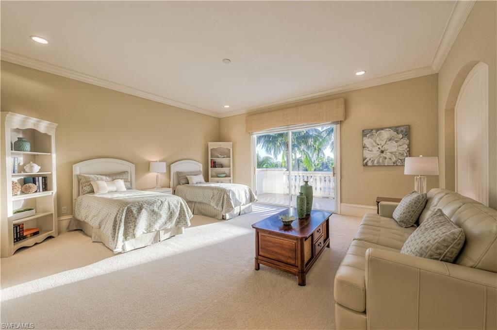 2829 Capistrano Way Naples, FL 34105 - Photo 29 of 35 a living room with furniture and a large window