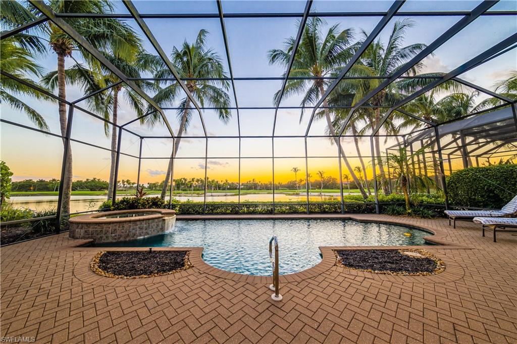 2829 Capistrano Way Naples, FL 34105 - Photo 7 of 35 a view of swimming pool with outdoor seating and plants