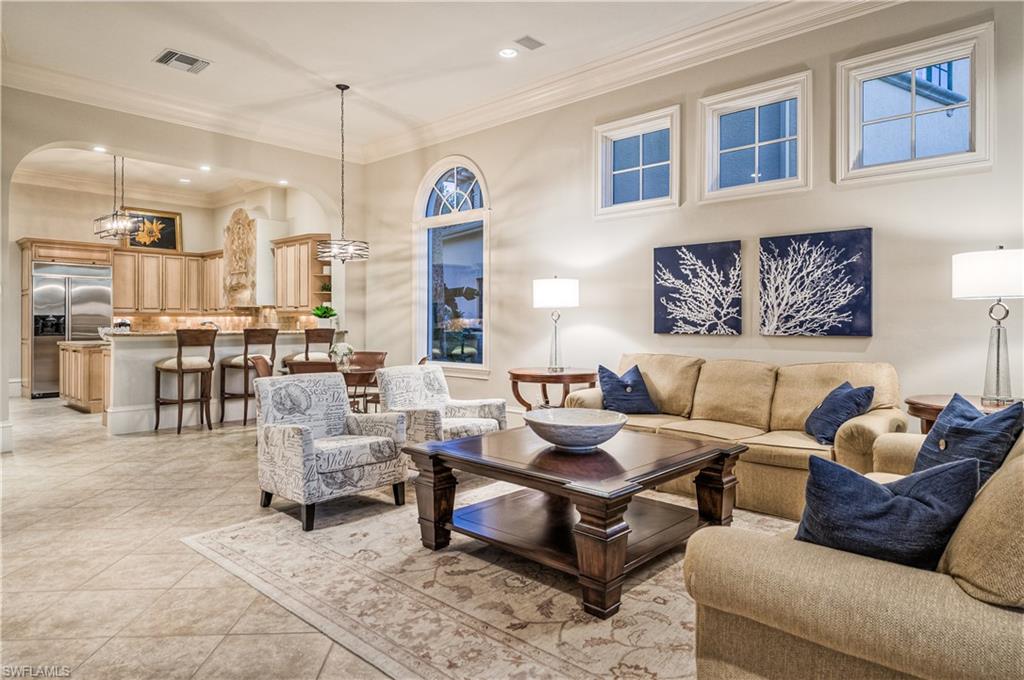 2829 Capistrano Way Naples, FL 34105 - Photo 9 of 35 a living room with furniture and a view of kitchen
