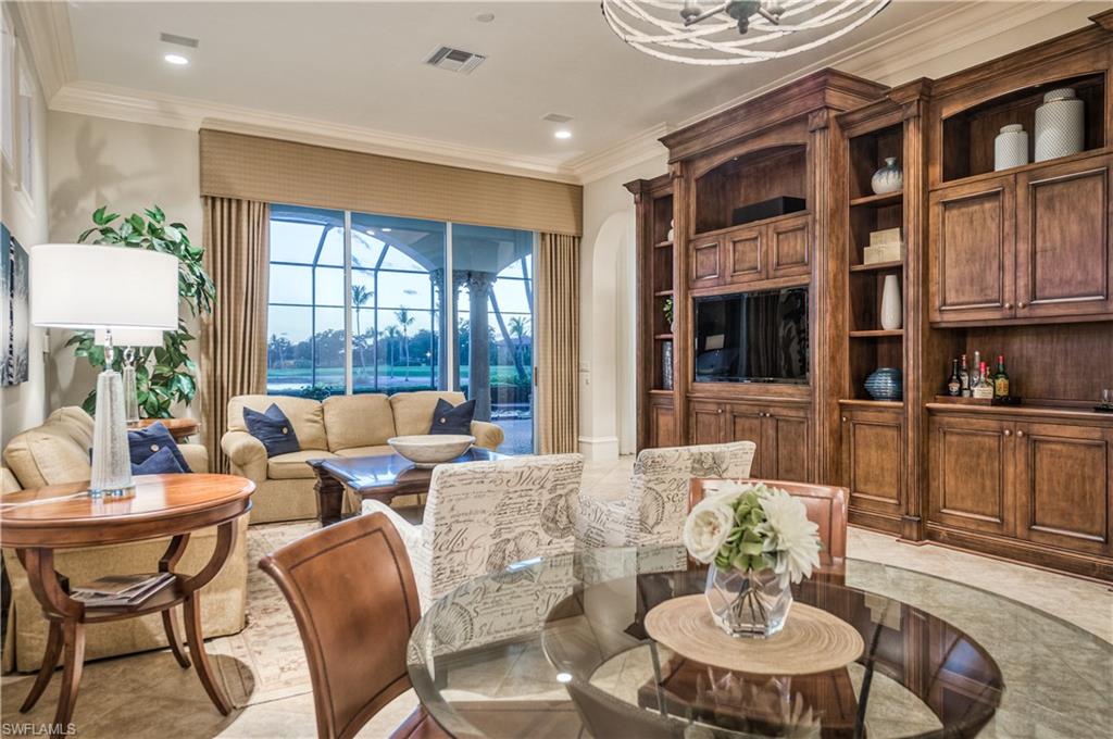 2829 Capistrano Way Naples, FL 34105 - Photo 10 of 35 a living room with furniture and a large window