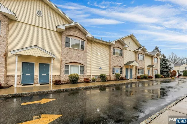 a front view of a house with swimming pool