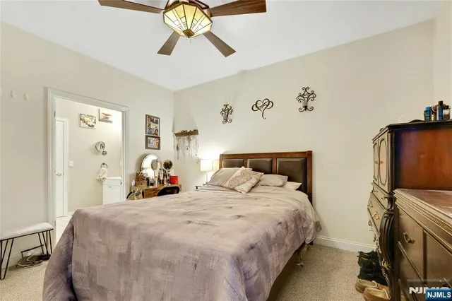 a bedroom with bed and window