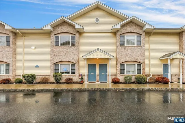 a front view of a house with swimming pool