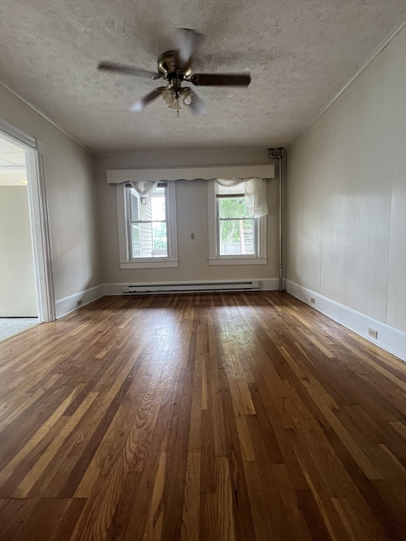 20 Sherwin Street, Unit A Ware, MA 01082 - Photo 5 of 10 wooden floor in an empty room with a window