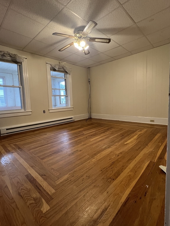 20 Sherwin Street, Unit A Ware, MA 01082 - Photo 8 of 10 an empty room with wooden floor and windows