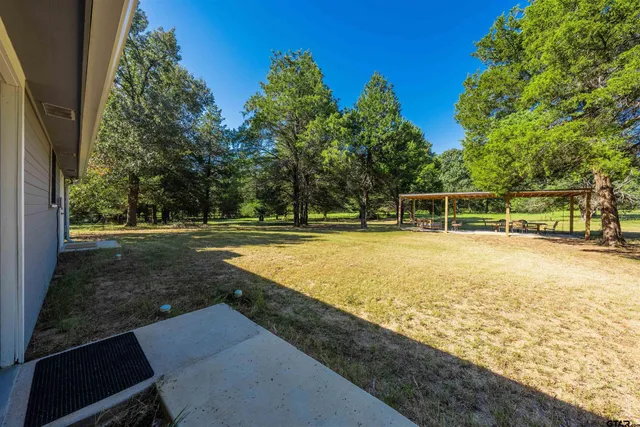 a view of a chairs and tables in the patio