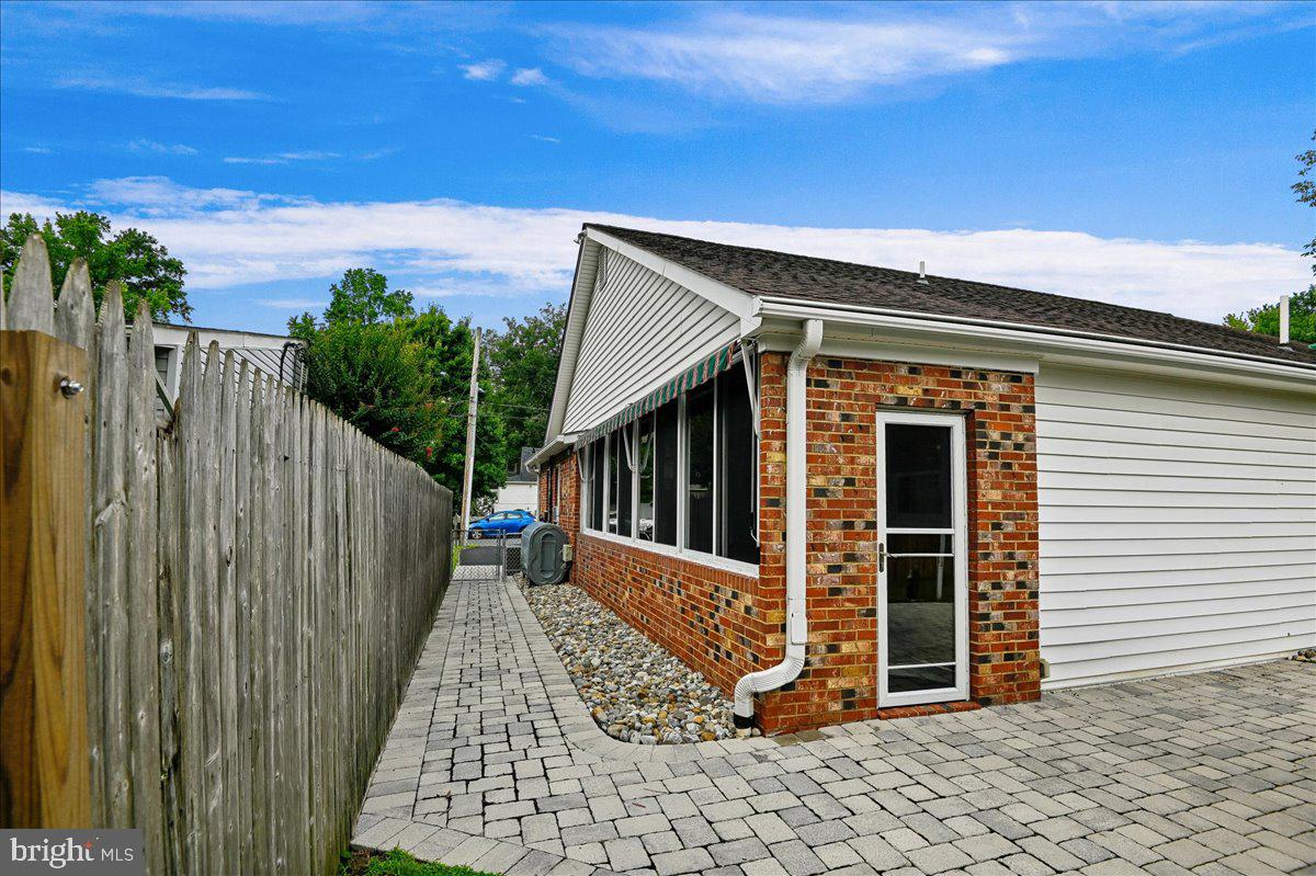 1731 Tacoma Road Edgewater, MD 21037 - Photo 7 of 59 Charming brick home with serene pathway.