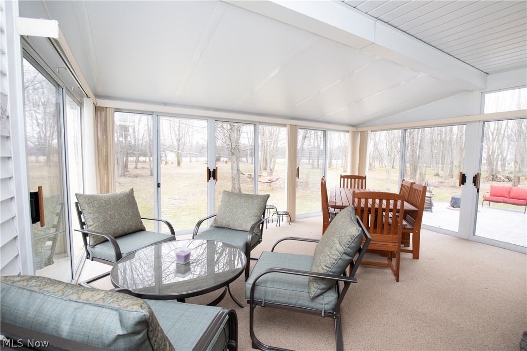 15031 Quarry Road Oberlin, OH 44074 - Photo 10 of 34 Screened in porch 18 x 14 is conveniently located next to the kitchen and off the Great Room. The side walls and front all have sliding doors to maximize the fresh breezes as you sit and relax