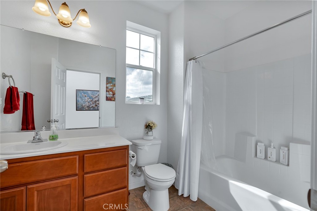 2936 Dillon Lane Merced, CA 95348 - Photo 19 of 34 a bathroom with a sink toilet and shower