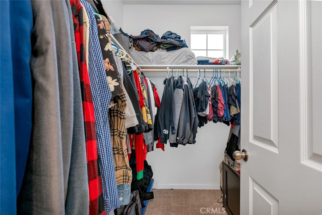2936 Dillon Lane Merced, CA 95348 - Photo 27 of 34 a view of walk in closet with clothes