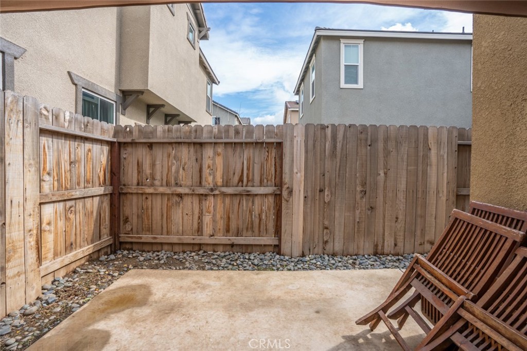 2936 Dillon Lane Merced, CA 95348 - Photo 29 of 34 a view of a small house with wooden fence