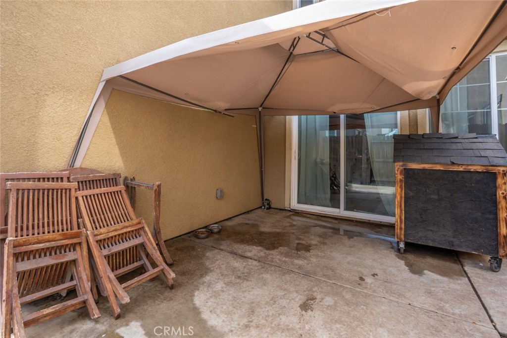 2936 Dillon Lane Merced, CA 95348 - Photo 30 of 34 a view of a house with stairs and a floor to ceiling window