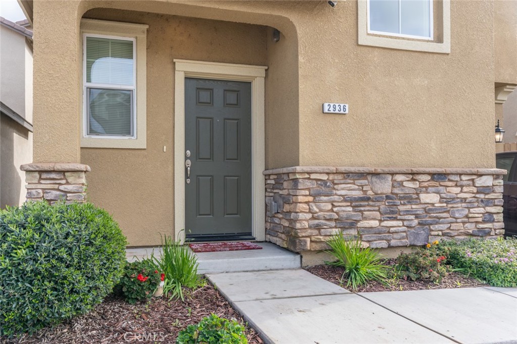 2936 Dillon Lane Merced, CA 95348 - Photo 3 of 34 a view of front door of house with potted plant