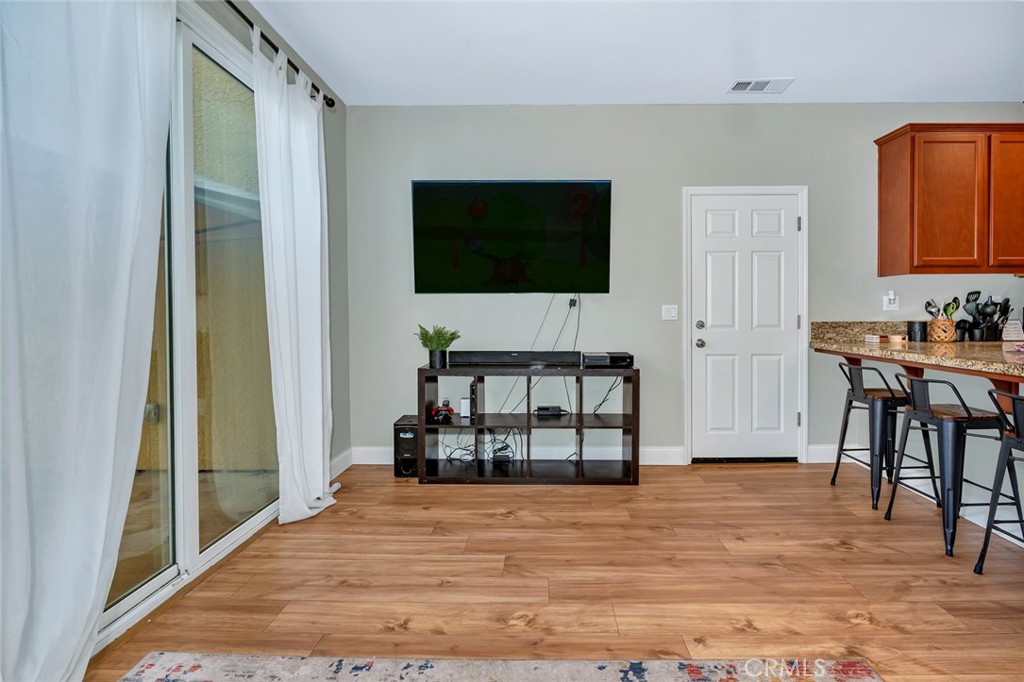 2936 Dillon Lane Merced, CA 95348 - Photo 10 of 34 a living room with furniture a flat screen tv and a table