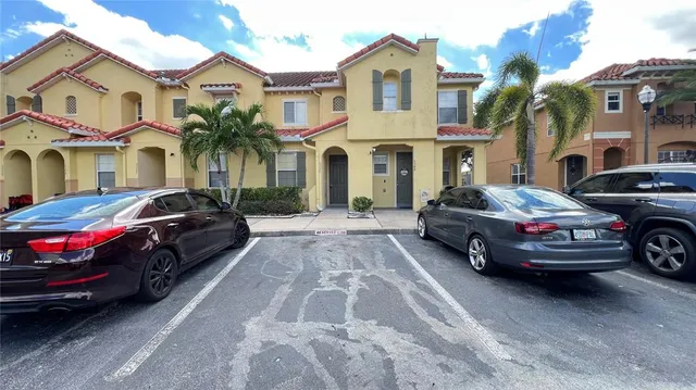 a view of a lake with a house in the background