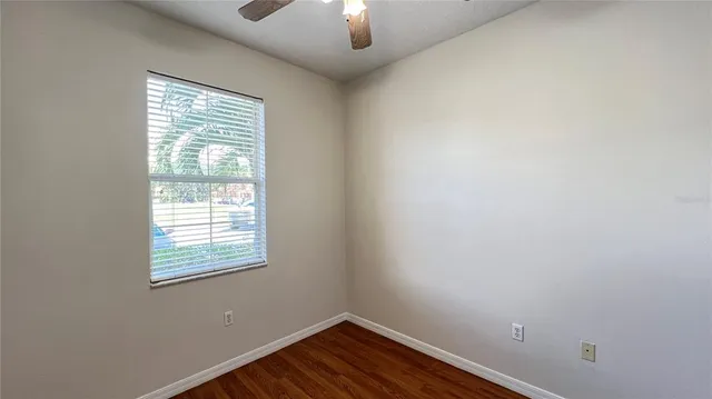 a bathroom with a granite countertop toilet and a shower