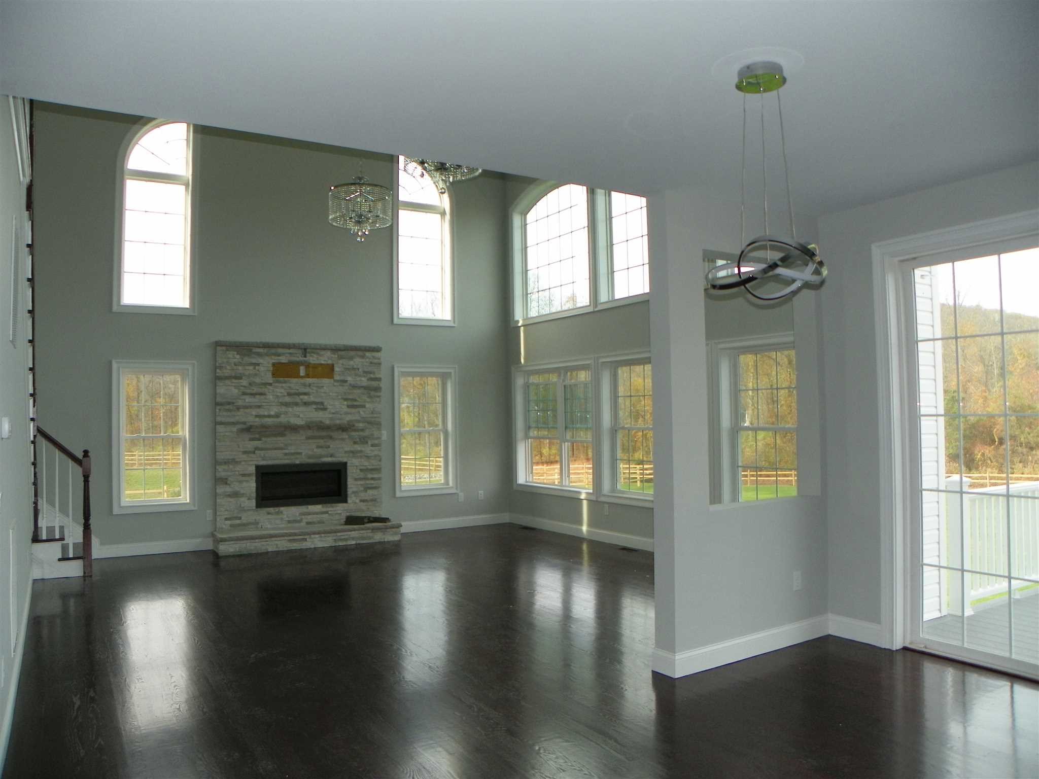 2 Lincoln Square Road Fishkill, NY 12524 - Photo 10 of 18 an empty room with wooden floor fireplace and windows