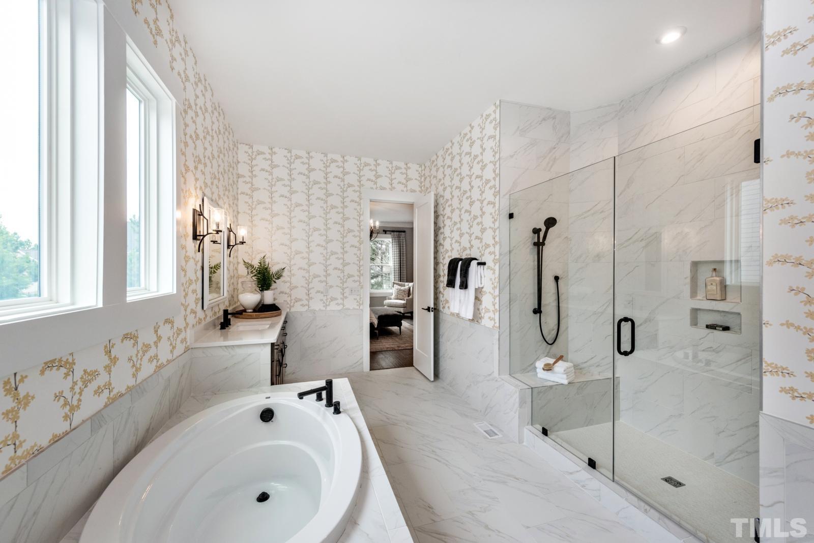 27 E Spring Angier, NC 27501 - Photo 16 of 35 a bathroom with a tub sink and mirror