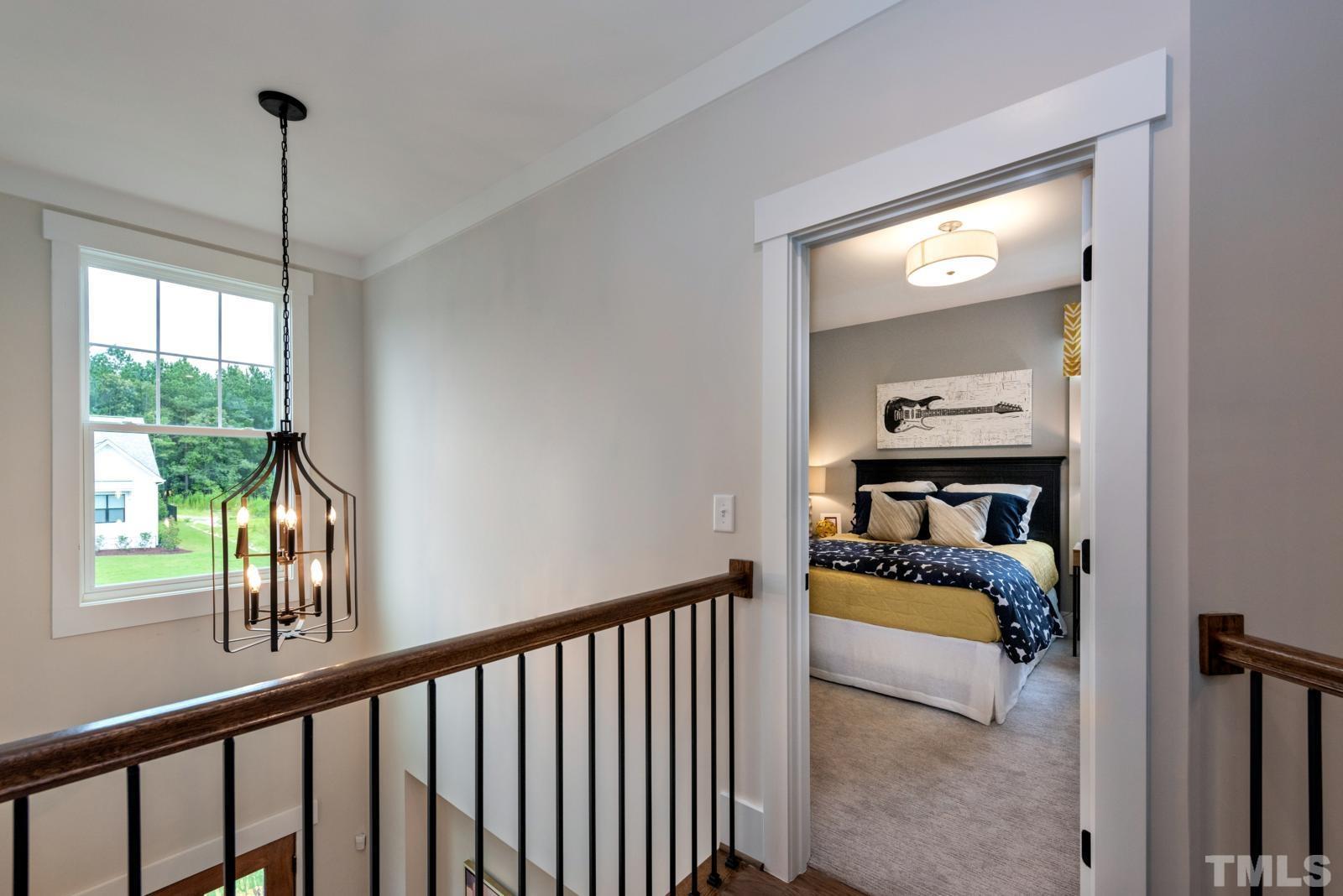 27 E Spring Angier, NC 27501 - Photo 24 of 35 a bedroom with furniture and a window