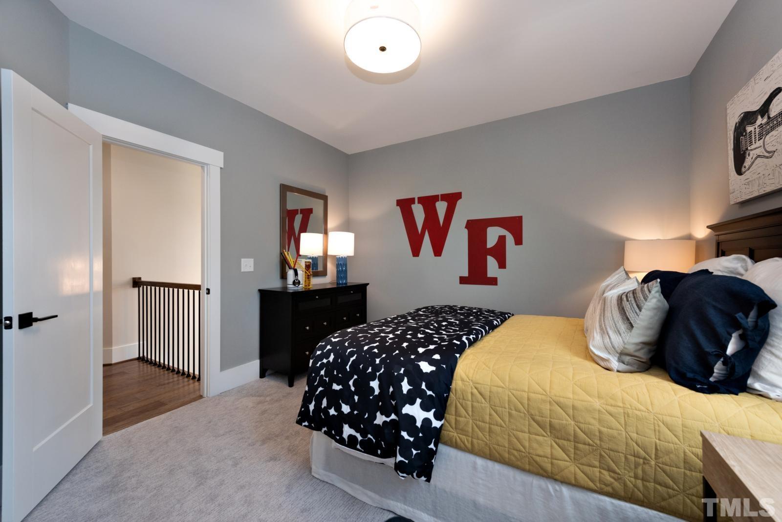 27 E Spring Angier, NC 27501 - Photo 25 of 35 a bedroom with a bed and a closet