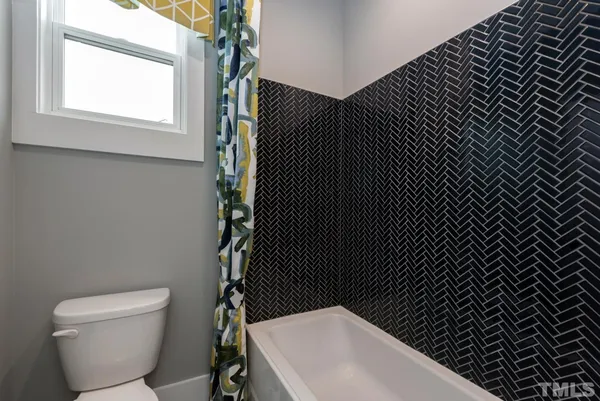 a bathroom with a toilet and a sink
