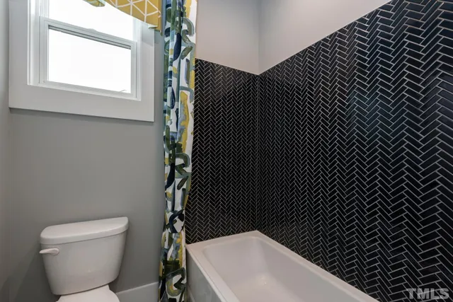 a bathroom with a toilet and a sink