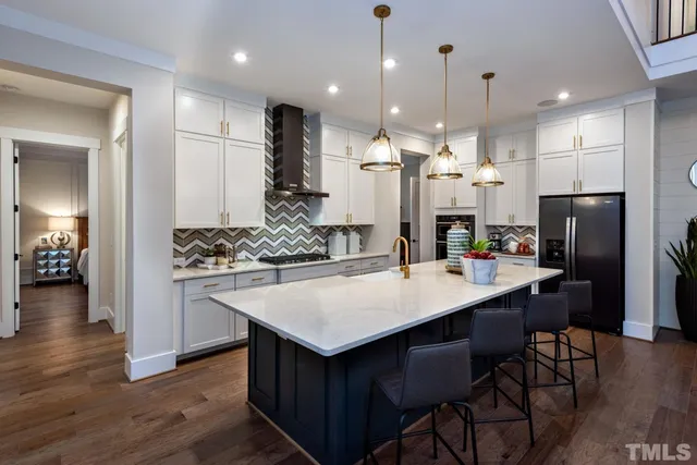 a kitchen with a table and chairs in it